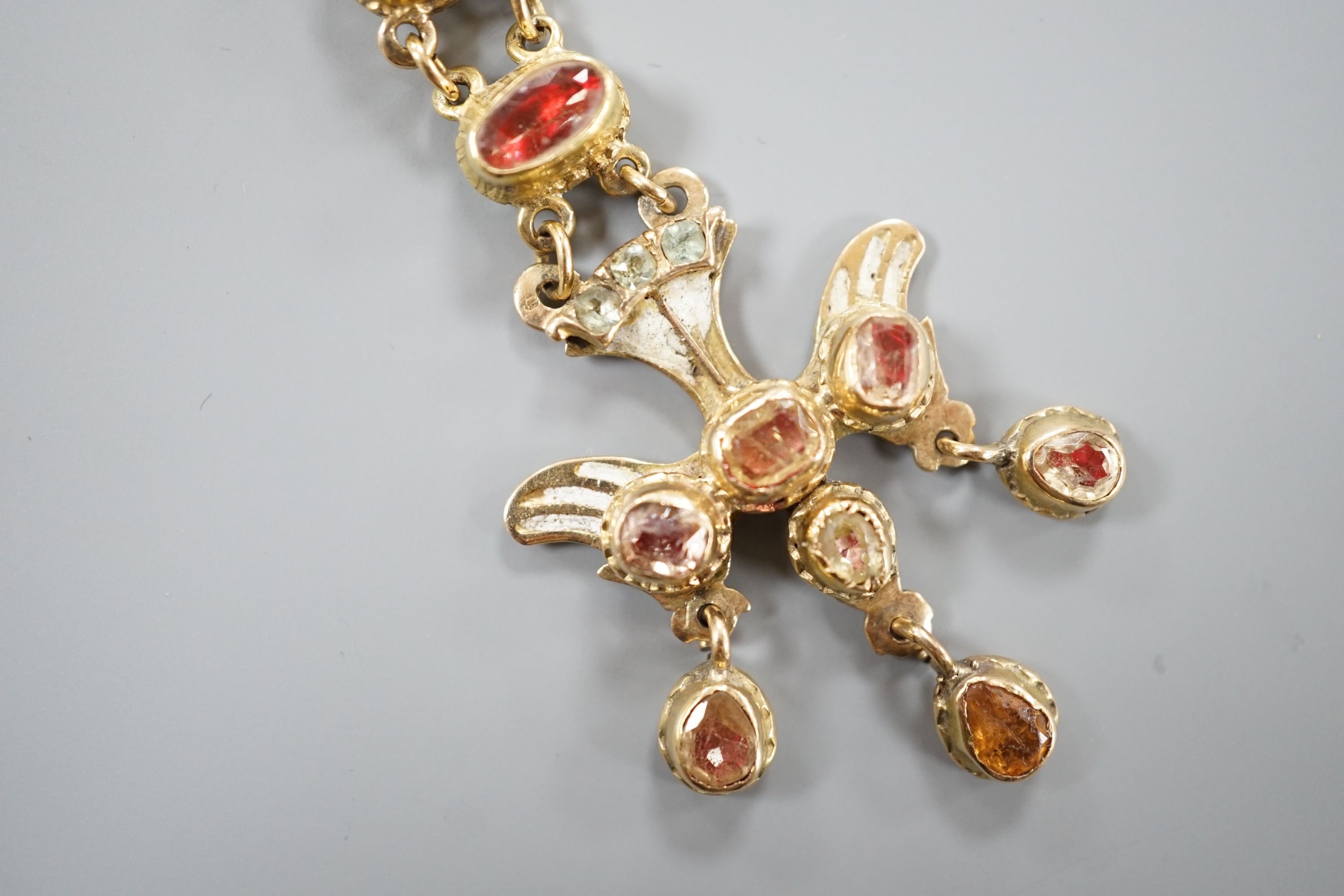 A 19th century yellow metal, foil backed gem and enamel set drop pendant, 69mm, gross weight 10.5 grams (a.f.).